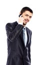 Handsome business man using cell phone, smiling Royalty Free Stock Photo