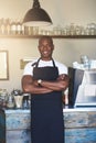 Handsome business owner stands by cafe counter Royalty Free Stock Photo