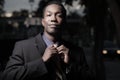 Handsome businessman adjusting his tie Royalty Free Stock Photo