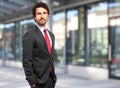 Handsome businessman against blurry background Royalty Free Stock Photo