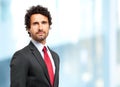 Handsome businessman against blurry background Royalty Free Stock Photo