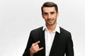 handsome businessman black suit hand gestures emotions isolated background Royalty Free Stock Photo