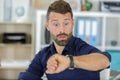 handsome businessman checking wrist-watch Royalty Free Stock Photo