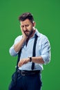 Handsome businessman checking his wrist-watch Isolated on white background Royalty Free Stock Photo