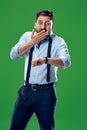 Handsome businessman checking his wrist-watch Isolated on white background Royalty Free Stock Photo