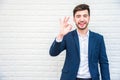 Handsome businessman doing okay or alright gesture. Business and Royalty Free Stock Photo