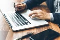 Handsome businessman Hands holding credit card and using laptop. Online shopping Royalty Free Stock Photo