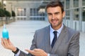 Handsome businessman holding a potion Royalty Free Stock Photo