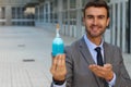 Handsome businessman holding a potion Royalty Free Stock Photo