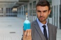 Handsome businessman holding a potion Royalty Free Stock Photo