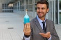 Handsome businessman holding a potion Royalty Free Stock Photo