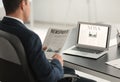 Handsome businessman reading financial newspaper in office Royalty Free Stock Photo