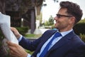 Handsome businessman reading newspaper Royalty Free Stock Photo