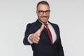 Handsome businessman ready to shake hands giving a big smile Royalty Free Stock Photo