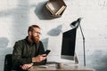 handsome businessman sitting holding smartphone Royalty Free Stock Photo