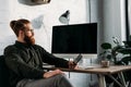 handsome businessman sitting holding smartphone Royalty Free Stock Photo