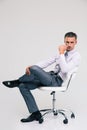 Handsome businessman sitting on office chair Royalty Free Stock Photo