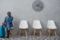 Handsome businessman sitting in a waiting room Royalty Free Stock Photo