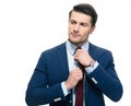 Handsome businessman straightening his tie Royalty Free Stock Photo