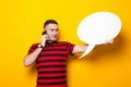 Handsome man in bright T-shirt with speech bubble Royalty Free Stock Photo