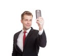 Handsome businessman taking a selfie