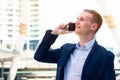 Handsome businessman talking mobile phone with client and confirm to attend meeting Royalty Free Stock Photo