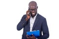 Handsome businessman talking on mobile phone while reading clipboard Royalty Free Stock Photo