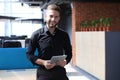 Handsome businessman using his tablet in the office Royalty Free Stock Photo