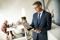 Handsome businessman using his tablet in the office Royalty Free Stock Photo