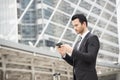 Handsome businessman using mobile phone. communication. Royalty Free Stock Photo