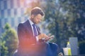 Handsome businessman using mobile phone with food and drink on table Royalty Free Stock Photo