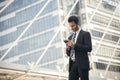 Handsome businessman using mobile phone. Royalty Free Stock Photo