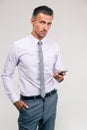 Handsome businessman using smartphone