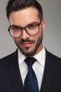 Handsome businessman wearing glasses smiles seductively Royalty Free Stock Photo