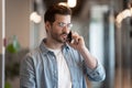 Businessman talking on phone contact with company client distantly