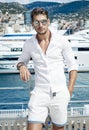 Handsome businessman wearing white clothes and sunglasses posing Royalty Free Stock Photo