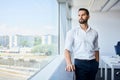 handsome businessman at work standing at office looking out window Royalty Free Stock Photo