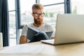 Handsome businessman working with laptop in office. Royalty Free Stock Photo