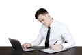 Handsome businessman writing on clipboard Royalty Free Stock Photo