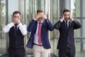 Handsome businessmen as the three wise monkeys