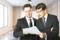 Handsome businessmen discussing contract Royalty Free Stock Photo