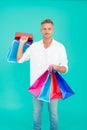 Handsome buyer. Free shipping. Mature man hold shopping bags. Cyber monday sale. Retail concept. Happy holidays