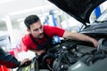 Car mechanic working at automotive service center Royalty Free Stock Photo