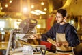 Handsome caucasian carpenter man work using machine for wood cutting Royalty Free Stock Photo