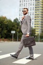 Handsome guy in suit walk, cross the street Royalty Free Stock Photo