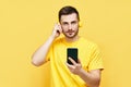 Handsome caucasian man listening to music from his phone and headphones Royalty Free Stock Photo