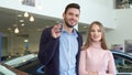 Man shows the car key at the dealership Royalty Free Stock Photo