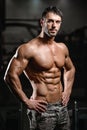 Caucasian fitness model in gym close up abs Royalty Free Stock Photo