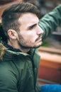 Handsome caucasian young man in casual clothes in urban environment