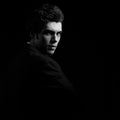 Handsome charismatic man looking serious in dark shadow dramatic Royalty Free Stock Photo